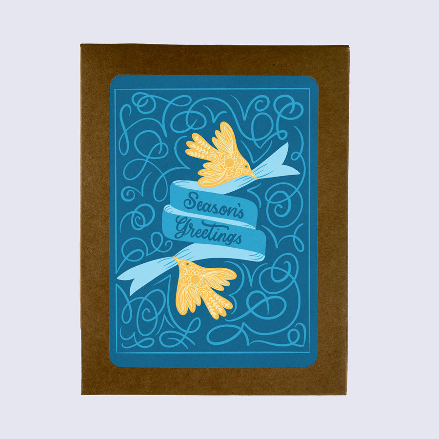 A folded greeting card with a blue background featuring yellow birds and the text &