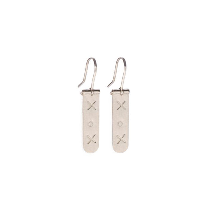 Sterling silver column hook earrings hand stamped with XOX by artisans in mexico, fair trade, hanging, artisan earrings in chicago