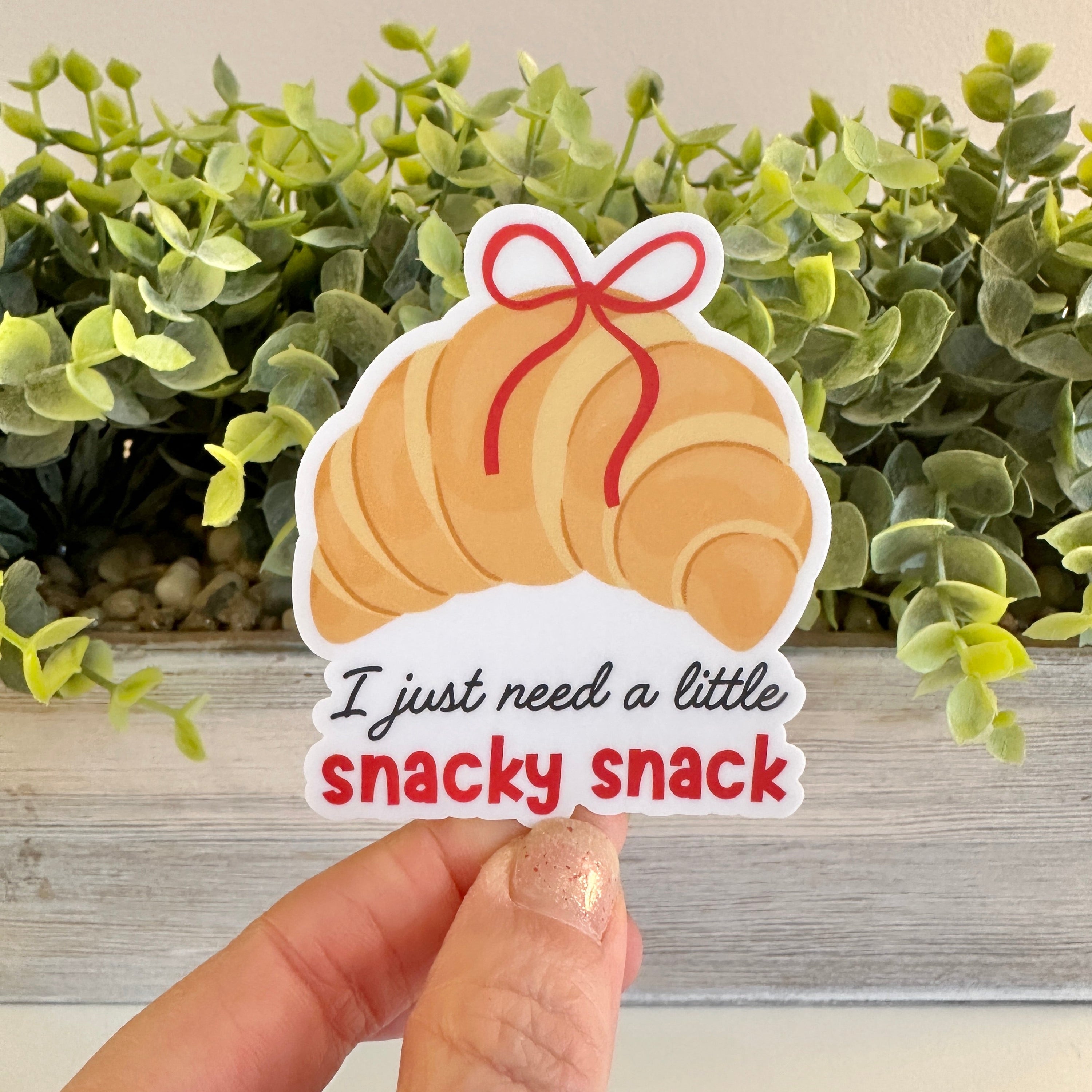 Sticker of a croissant with text &