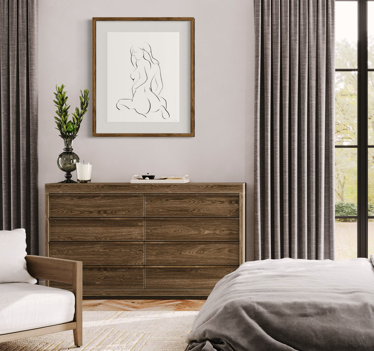 Black and white elegant illustration of sensual woman in seated pose with feminine curves; matted and framed on wall in neutral modern bedroom