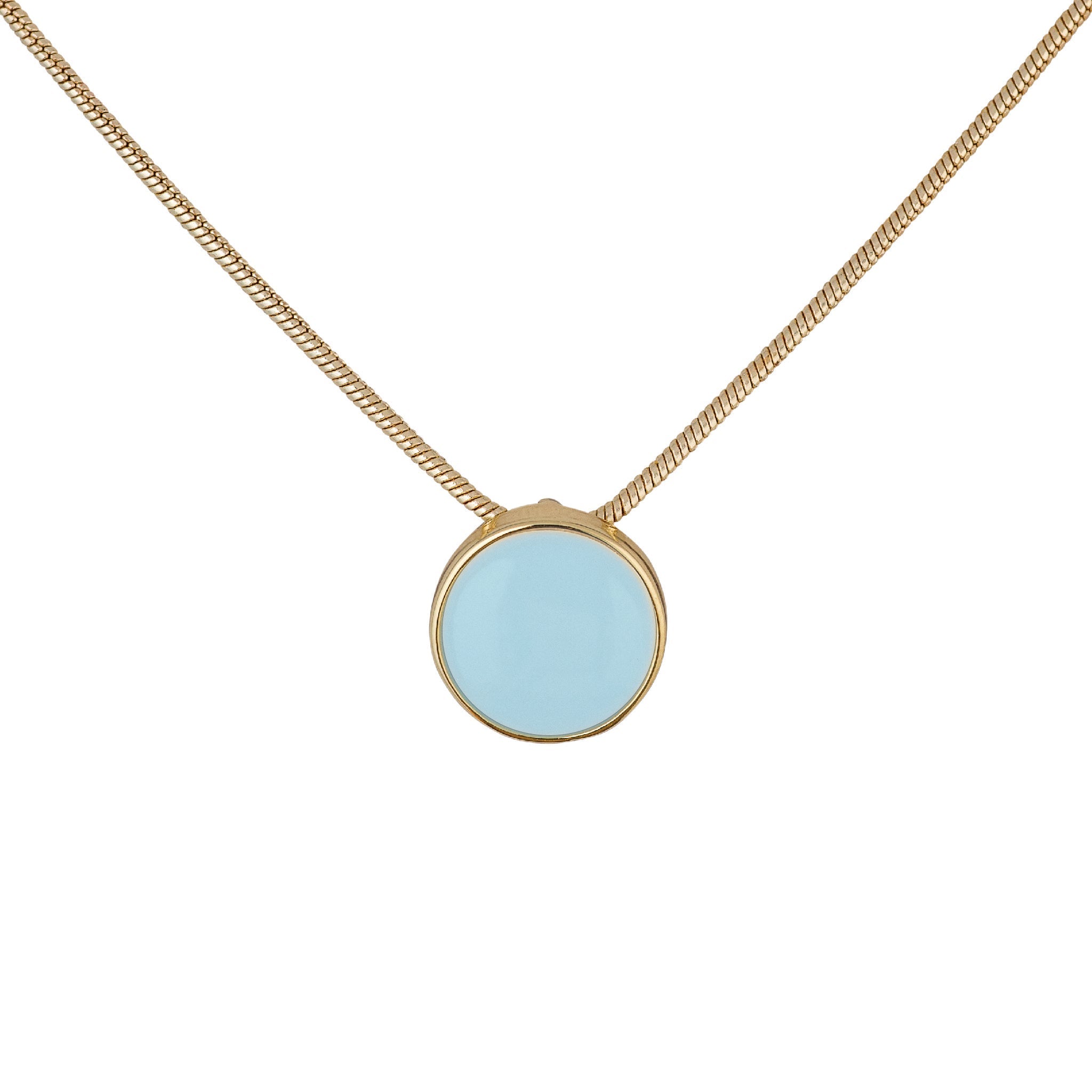 a small circular pendant with a gold bezel set crisp aqua enamel center. The pendant hangs from a gold-plated brass snake chain. and has a white background.