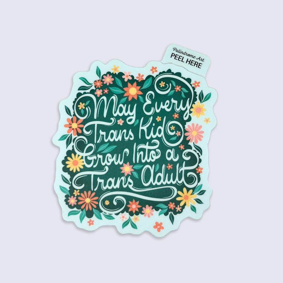 Sticker with floral design and text that says "may every trans kid grow into a trans adult"