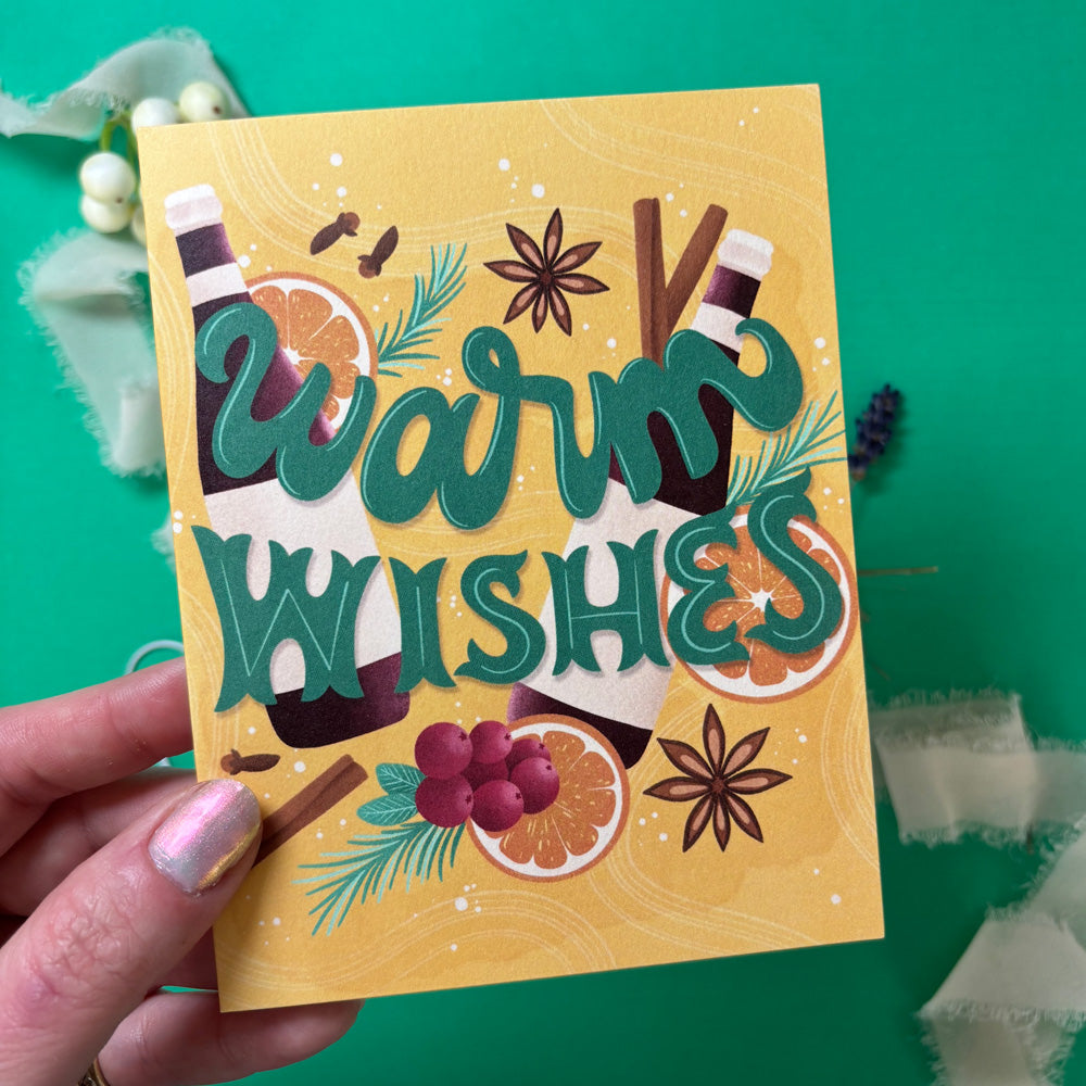 Hand holding a card with &