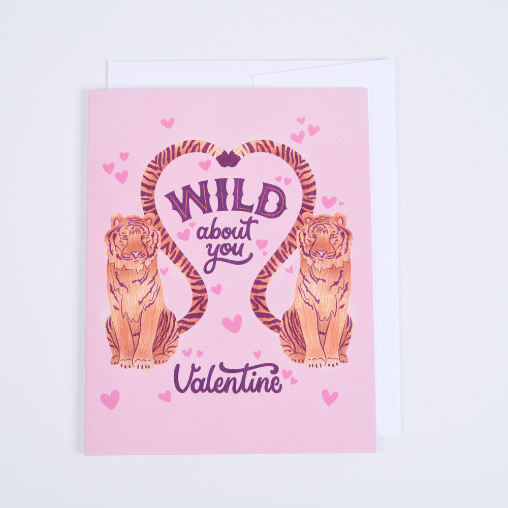 A pink folded greeting card with &