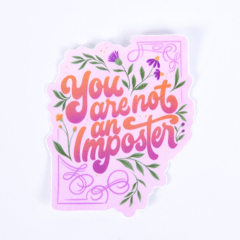 A sticker with a floral design and the lettering &
