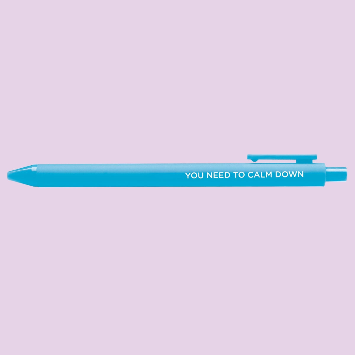 You Need to Calm Down pen styled on a desk — bright blue jotter gel pen by indie artist MangoIllustrated