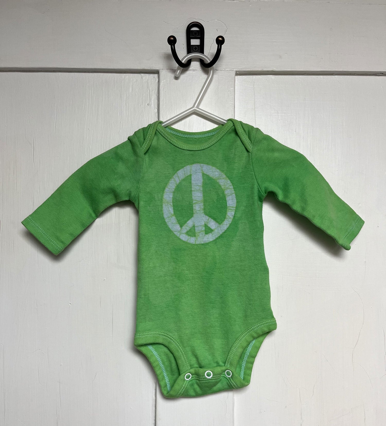Long sleeve peace sign baby bodysuit