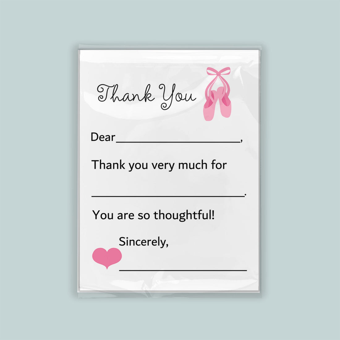 The image is a white thank you card with a pink ballet shoe graphic and a heart symbol. The card has a blank space for a recipient&