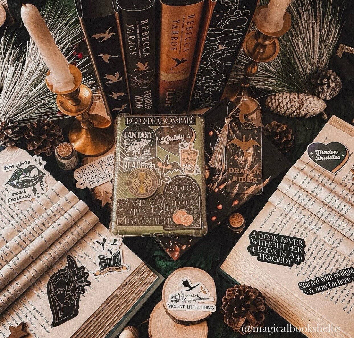 Decorative setup with books, candles, and decorative items on a table.