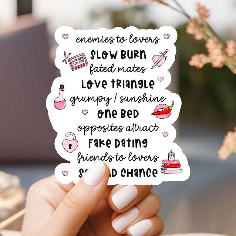 Hand holding a card with romantic relationship terms and icons.