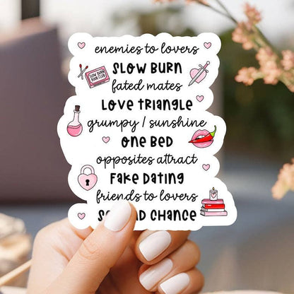 Hand holding a card with romantic relationship terms and icons.