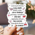 Hand holding a card with romantic relationship terms and icons.