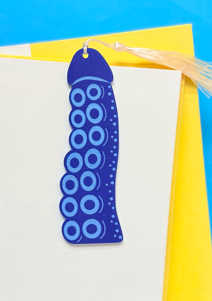 Blue circular patterned bookmark on a yellow and blue background