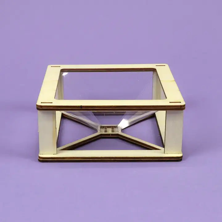 DIY hologram kit, clear glass display case with wooden frame on a purple background