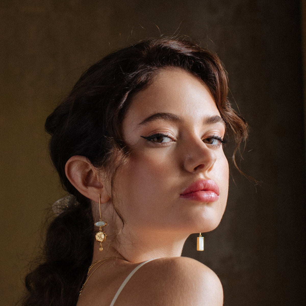 Handmade gold jewelry, earrings, on model