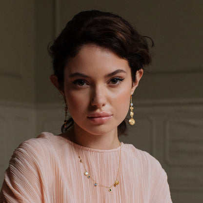 artisan handmade necklace and earrings, on model