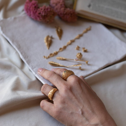 Bromelia collection handmade gold rings, on model