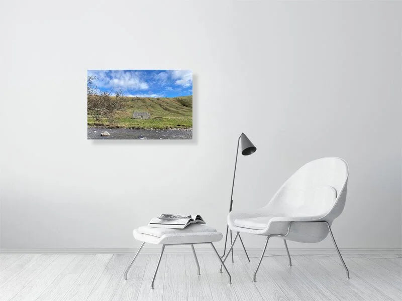 Sample print of a photograph of a stone cottage under a bright blue sky on the bank of the River Tilt in Scotland.