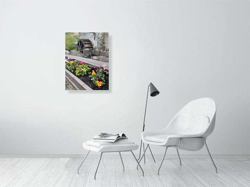 Fine art photograph of an antique wood and stone water mill waterwheel and a flower box taken in Scotland sample image.