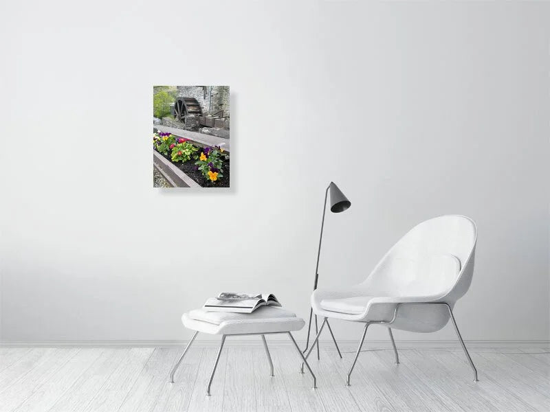 Fine art photograph of an antique wood and stone water mill waterwheel and a flower box taken in Scotland sample image.