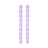 Pair of light purple taper candles molded as stacked skulls, on white.