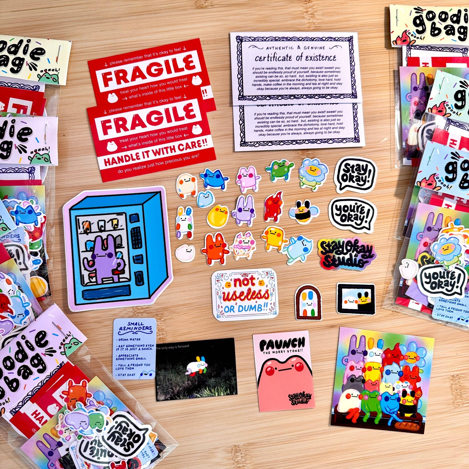 Collection of colorful stickers and cards on a wooden surface
