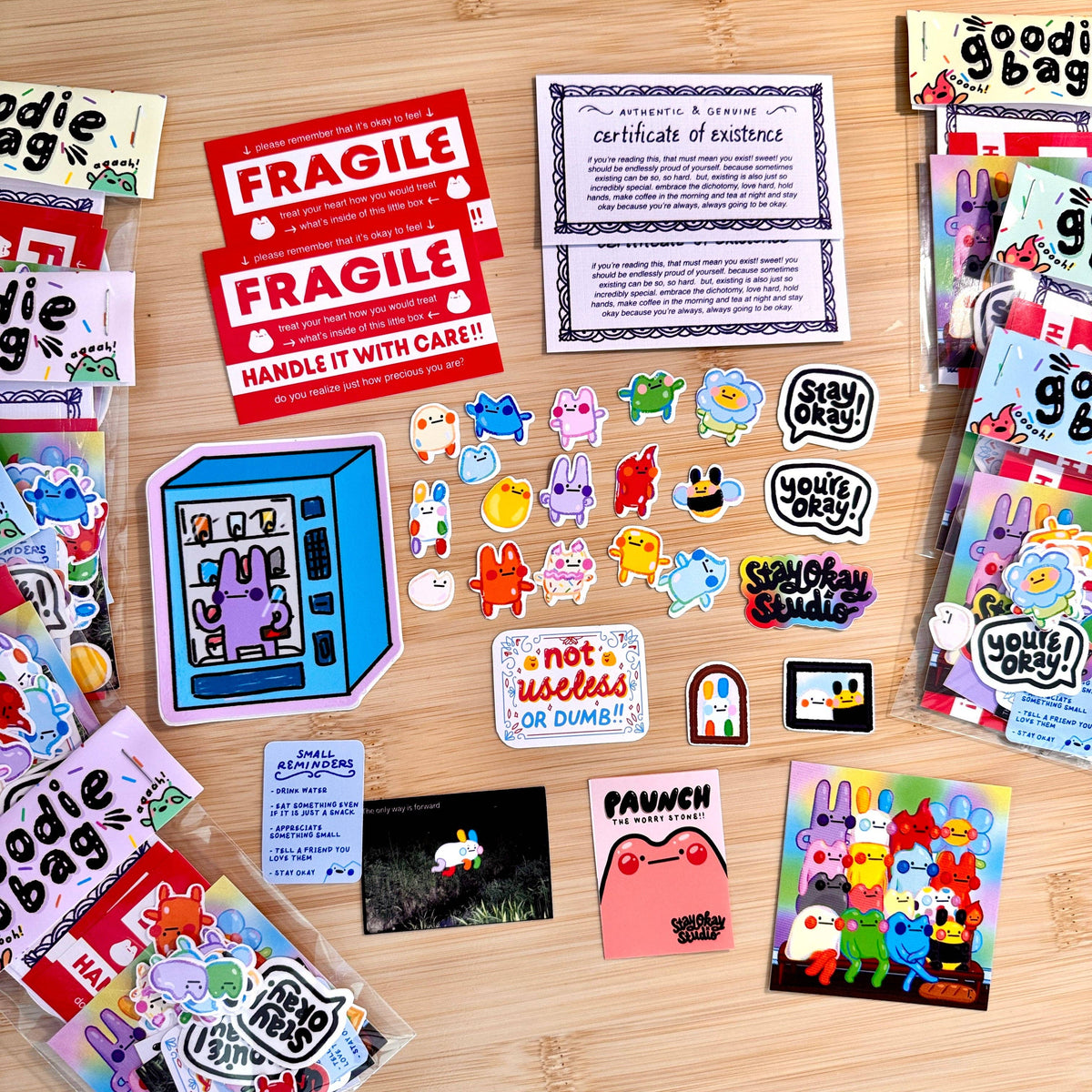Collection of colorful stickers and cards on a wooden surface
