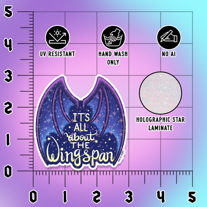 A wing-shaped sticker or decal with a purple and blue galaxy design and the text &