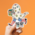 Sticker of a ghost holding books with text &