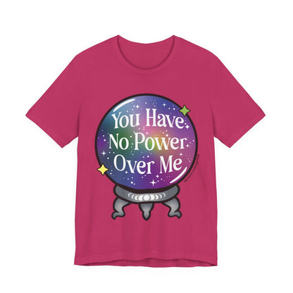 A bright pink short-sleeve t-shirt with a graphic of a crystal ball containing a purple galaxy background and the text &