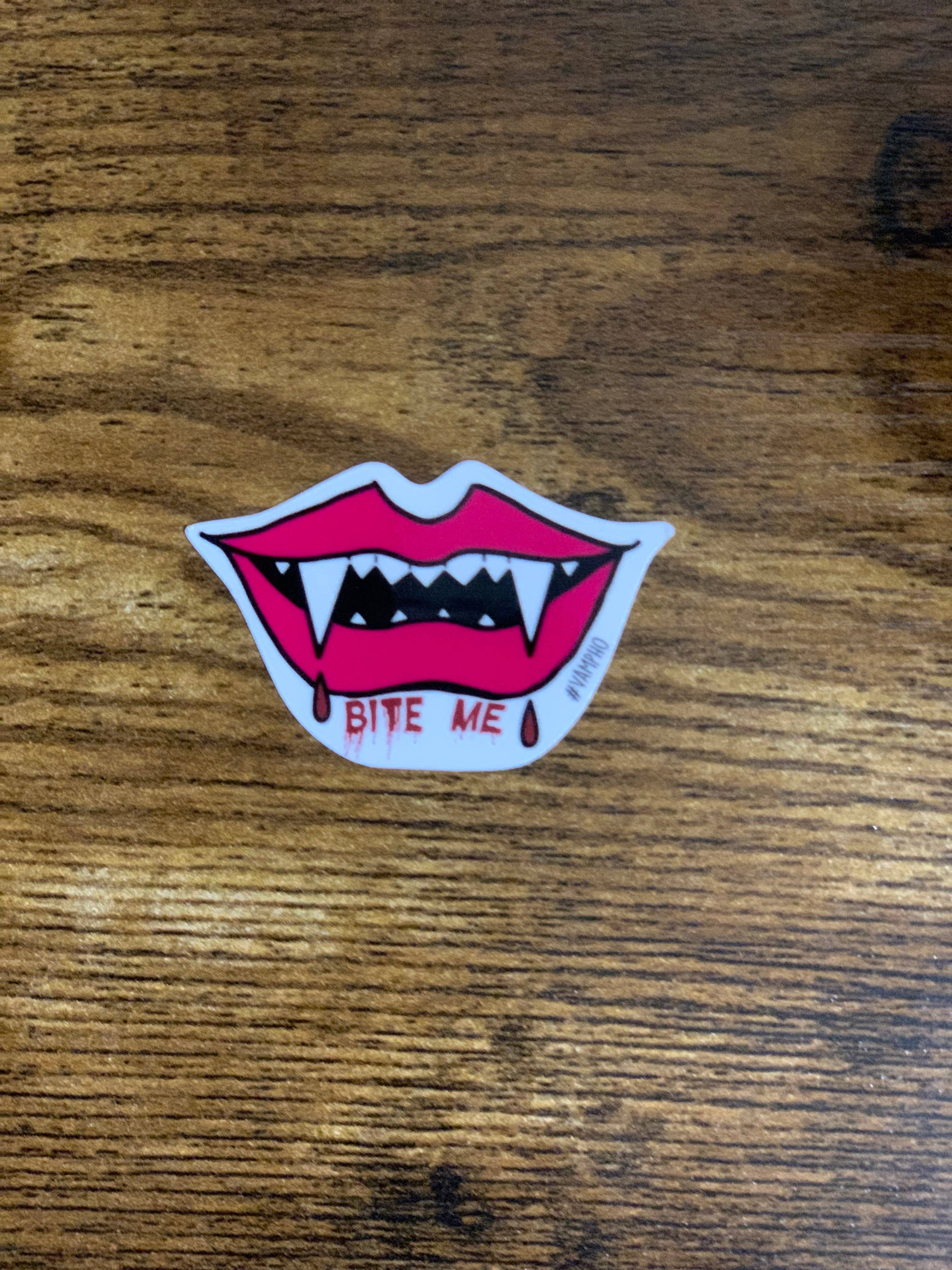 Sticker of a mouth with fangs and &