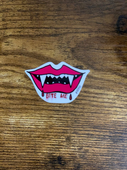 Sticker of a mouth with fangs and &
