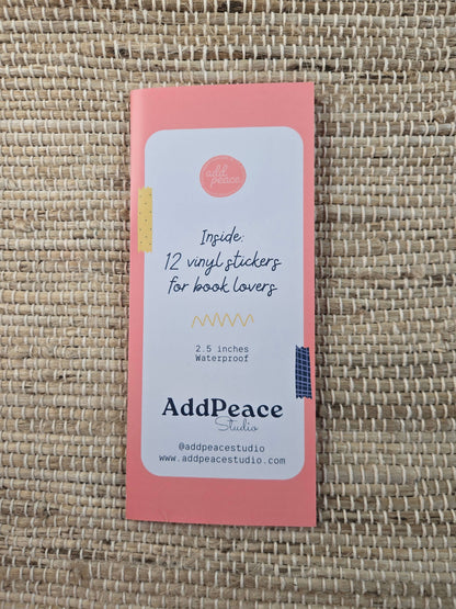 Pink packaging with AddPeace branding on a woven surface