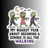 A die-cut sticker featuring three cartoon zombies walking under a crescent moon and clouds, with the text &