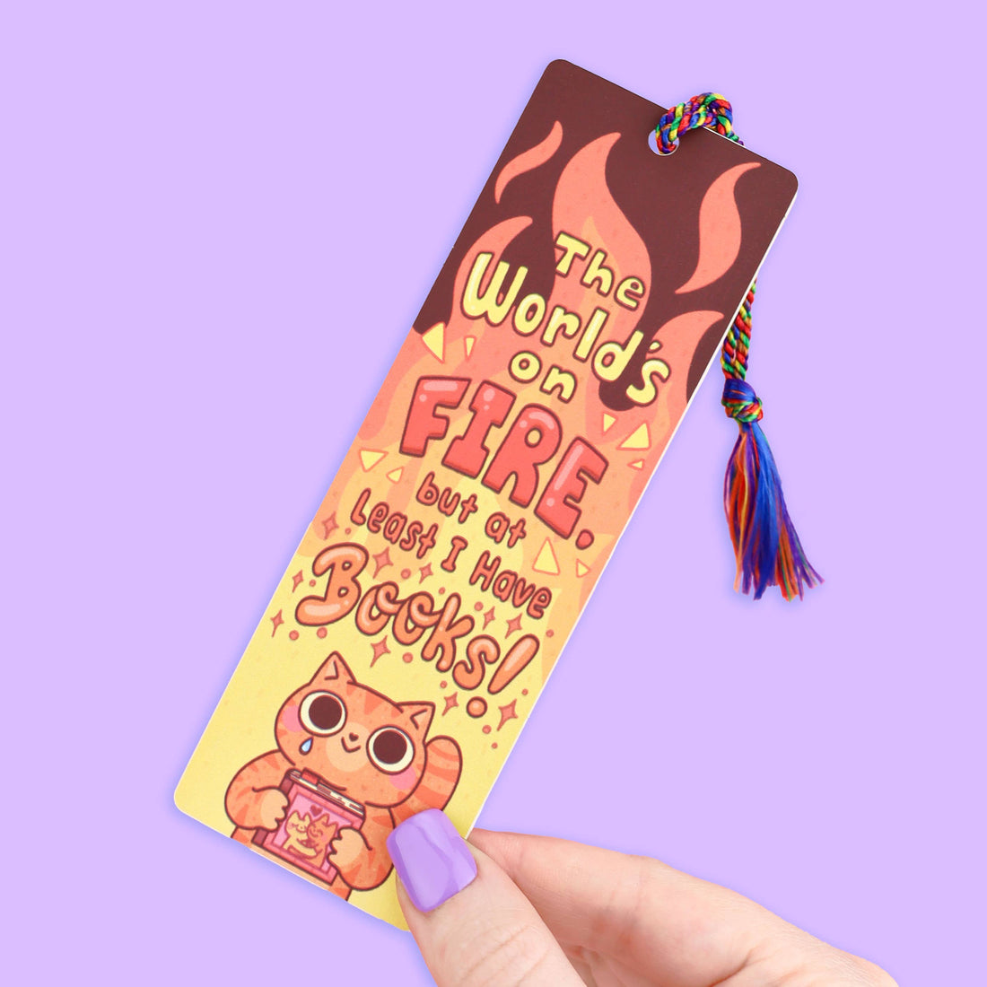 Colorful bookmark with a cat illustration and text on a purple background