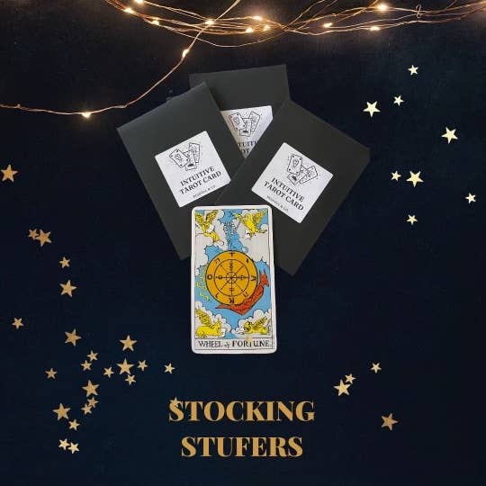 Tarot cards with star decorations on a dark background, labeled &