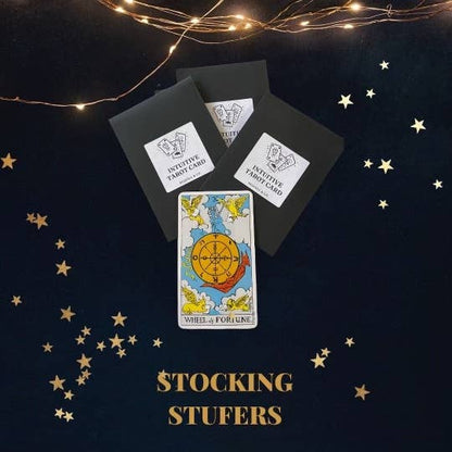 Tarot cards with star decorations on a dark background, labeled &