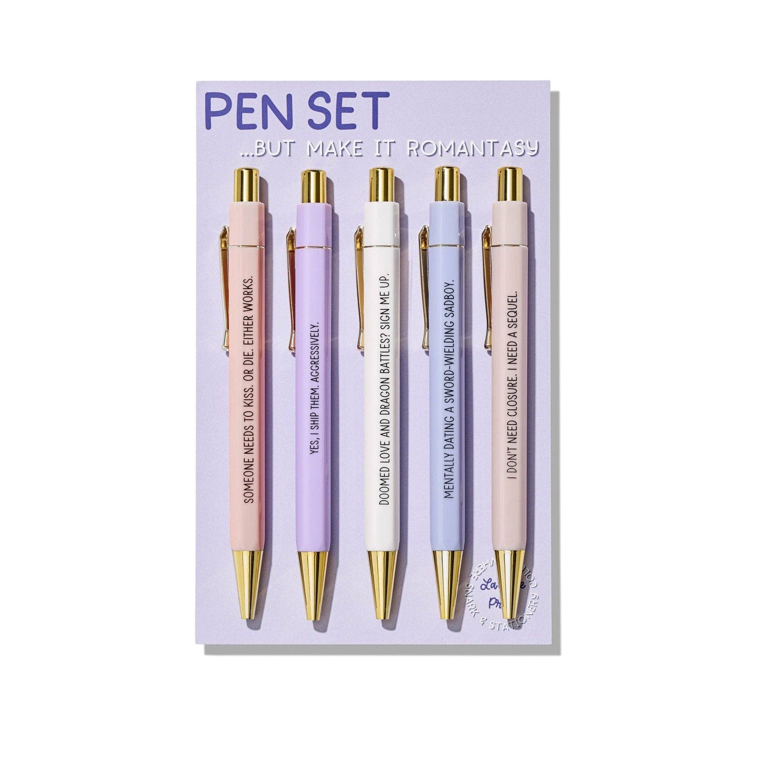 Set of five pens with gold accents on a purple card with text