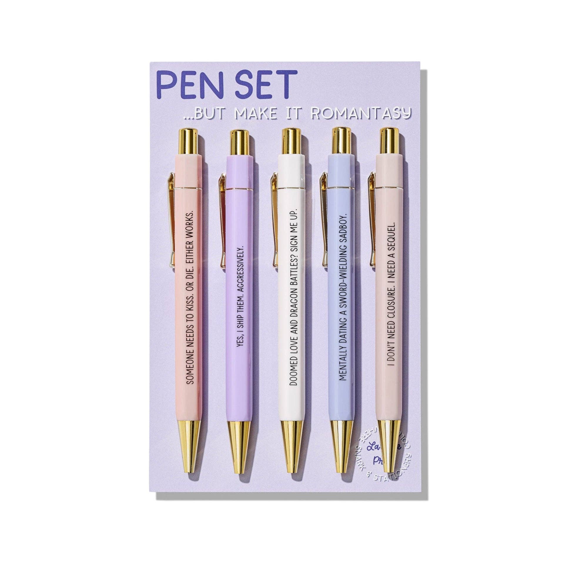 Set of five pens with gold accents on a purple card with text