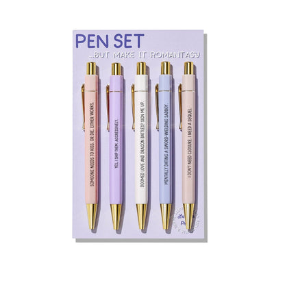 Set of five pens with gold accents on a purple card with text