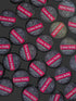 Multiple containers of Tattoo Balm with visible branding on a dark background