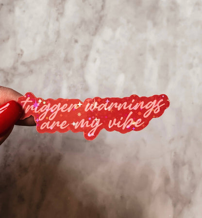 Red sticker with text &
