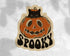 Halloween-themed sticker with a black cat on a pumpkin and &