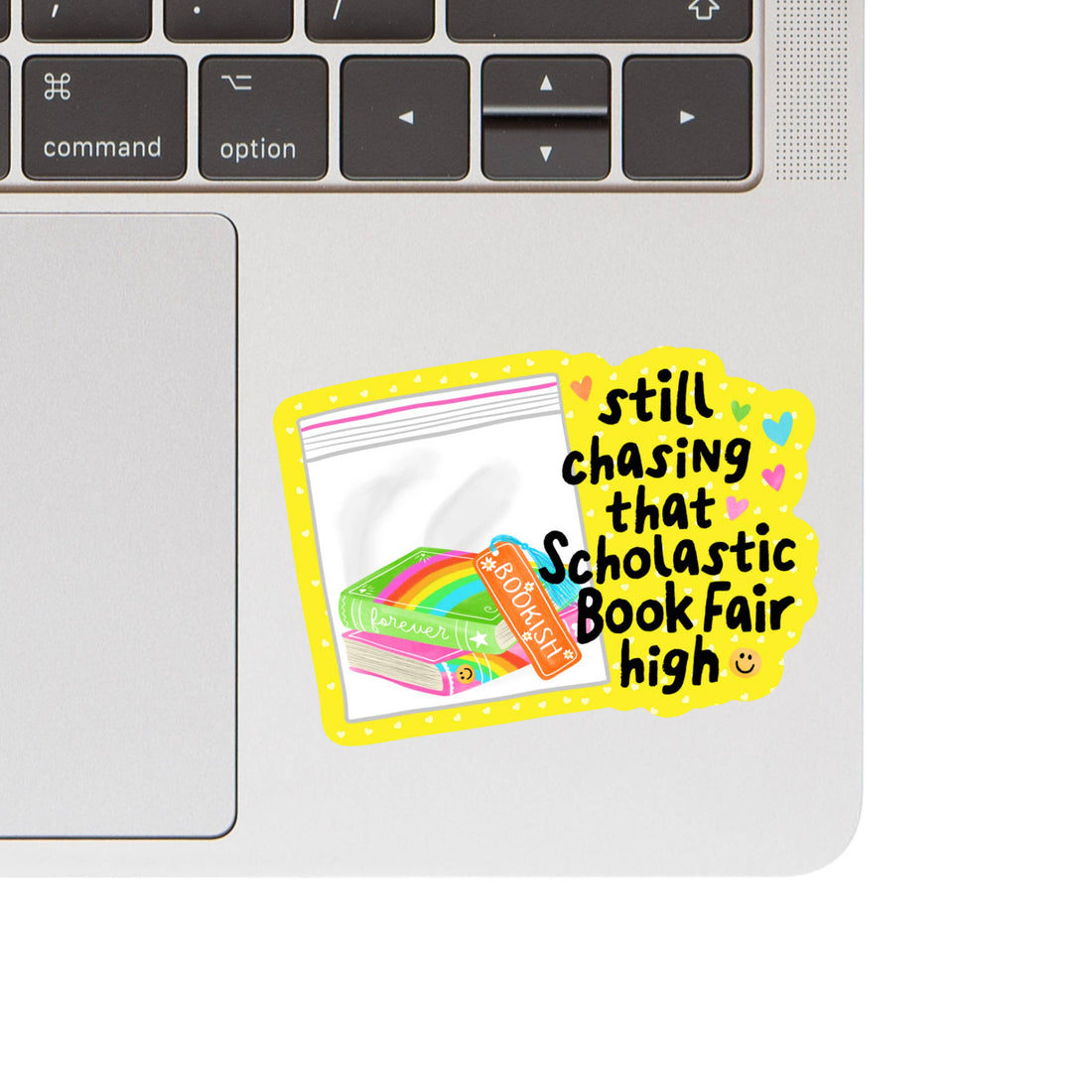 Laptop with a colorful sticker reading &