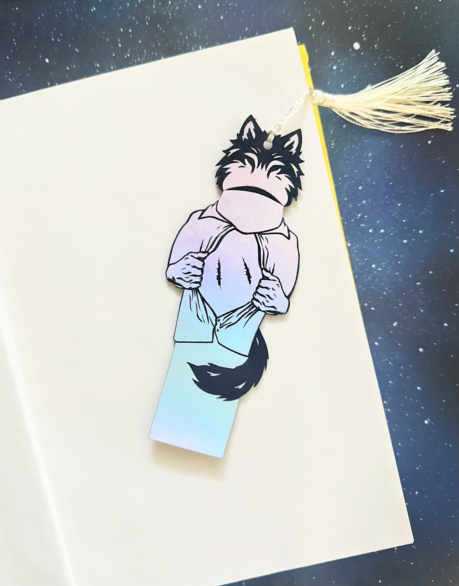 Bookmark with wolf design on a starry night background