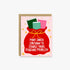 A Christmas-themed greeting card with a kraft envelope, featuring an illustration of a red Santa sack with three books peeking out and the text &