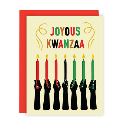 A Kwanzaa greeting card with a red envelope, featuring the words &