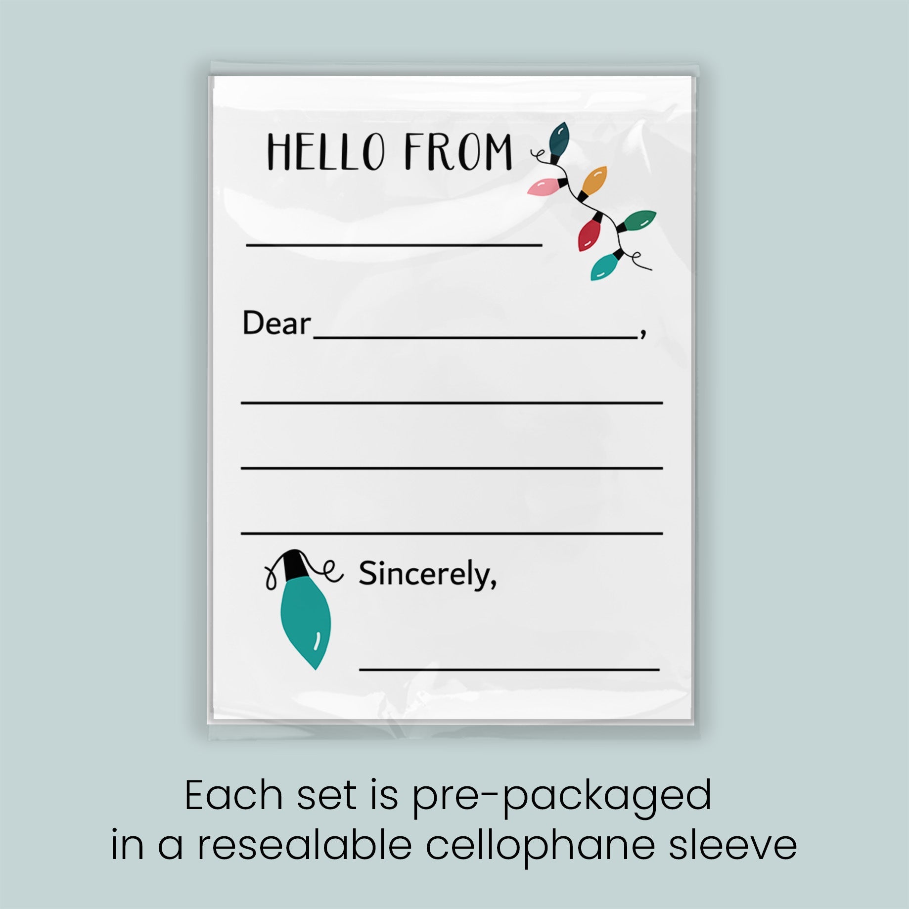 The image is a greeting card with a blank space for a message and a decorative element of a string of colorful lights. Each set is pre-packaged in a resealable cellophane sleeve.