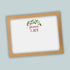 A white card with a brown frame, featuring a decorative wreath and the text "Peace & Joy" in a cursive font.