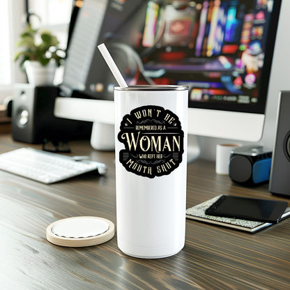 White tumbler with a black graphic on a desk with computer equipment in the background